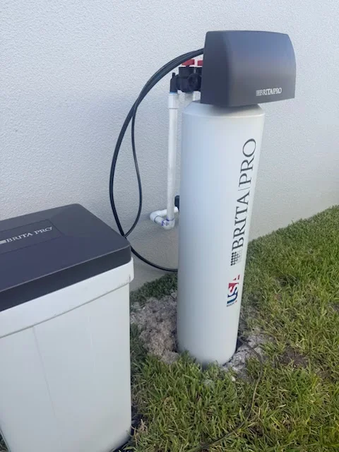 Brita PRO water softener tank and brine cabinet installed outside a Florida home